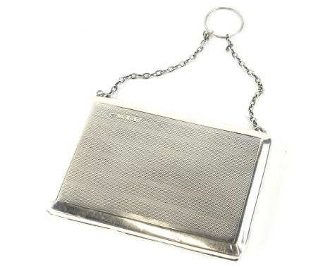 A George VI silver Art Deco evening purse, with chain handle, engine turned body, Birmingham 1942, 10cm wide, 3oz all in.