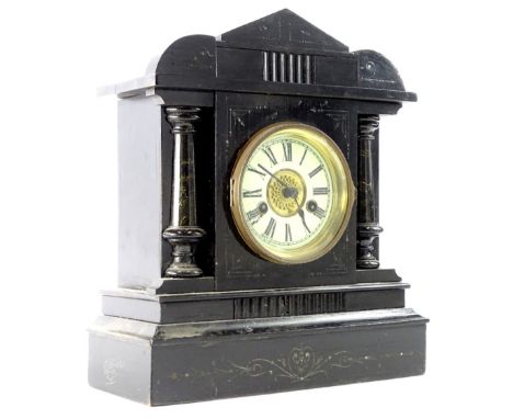 A German ebonised mantel clock, labelled for Junghans, with cross arrows, etc., 37cm H.