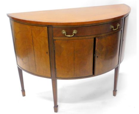 A late 19th/early 20thC mahogany and boxwood strung demi lune side cabinet, with a frieze drawer flanked by two doors above t