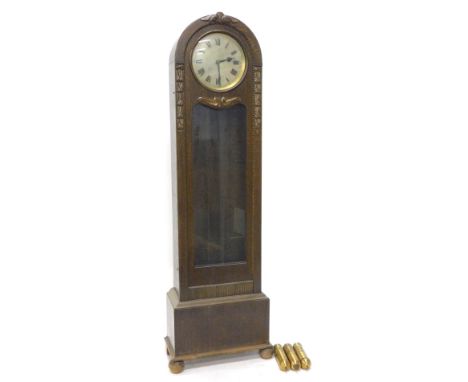 An early 20thC oak cased dome topped longcase clock, with a shaped glazed front, beaded border, flanked by acanthus leaf moul