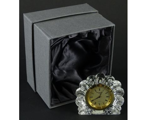 A Waterford crystal quartz mantel clock, in shaped case and outer box, label beneath, 8cm high.