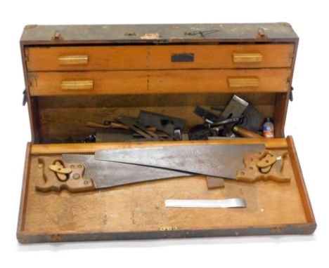 A 19thC tool cabinet, of rectangular form, with metal locks and side handles, 17cm high, 85cm wide, 46cm deep, set with two p
