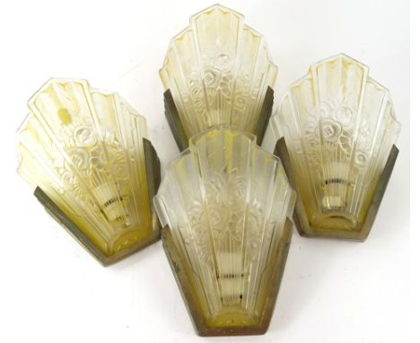 A set of four 20thC Art Deco glass fronted wall sconces, each with fan shaped yellow and clear glass moulded shades, set with