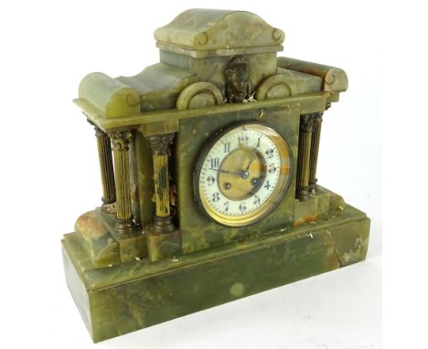 A 19thC green marble mantel clock of classical design, the shaped top centred by a Classical mask, above a 12cm diameter Arab