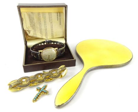 A George V silver and yellow enamel hand mirror, of shaped form, Birmingham 1929, 25cm wide, a Cymaflex gentleman's wristwatc