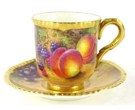 A 20thC Royal Worcester coffee cup and saucer, by John Freeman, each piece hand painted with summer fruits, brambles and appl