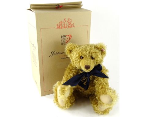 A Steiff 100 year anniversary blonde teddy bear, with blue bow and growl action, 44cm (boxed, with certificate)