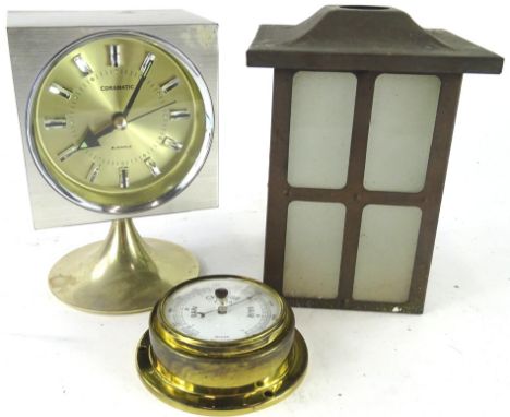 A Coramatic four jewel retro mantel clock, in square case, on inverted stem and circular foot, with shaped dial, 18cm high, a