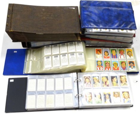 Various cigarette cards in albums, to include John Player &amp; Sons Army Corps, Gallaher Army Badges, Famous Film Scenes, Tr
