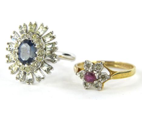 A 9ct gold dress ring, with floral head, claw set with pink stones, surrounded by small white stones, on a part pierced shank