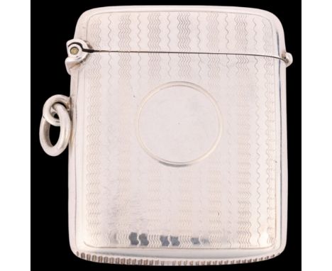 An Art Deco George V silver Vesta case, Constantine & Floyd Ltd, Birmingham 1913, rectangular form with engine turned decorat