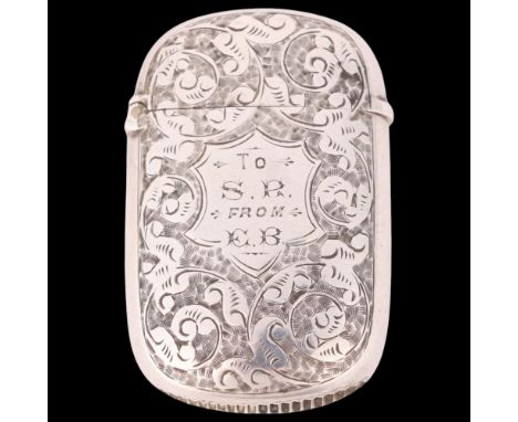 A Victorian silver Vesta case, Horton & Allday, Birmingham 1886, rounded oval form with allover foliate engraved decoration a