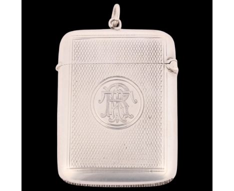 A late Victorian silver Vesta case, George Unite, Birmingham 1899, rounded rectangular form with allover engine turned decora