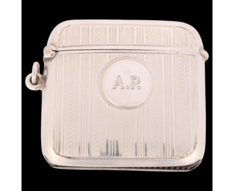 An Art Deco George VI silver Vesta case, maker RN, Birmingham 1945, curved rectangular form with allover engine turned decora