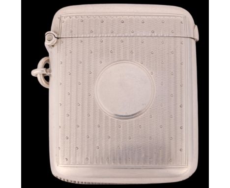 An Edwardian silver Vesta case, William Neale & Sons, Chester 1907, rounded rectangular form with engine turned decoration an