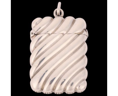 A Victorian silver Vesta case, John Millward Banks, Birmingham 1888, rectangular form with relief embossed spiral decoration 