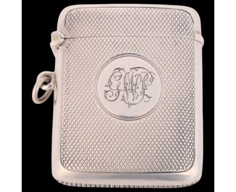 An Edwardian silver Vesta case, JW Benson Ltd, Birmingham 1903, curved rectangular form with allover engine turned decoration