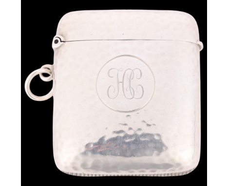 An Edwardian silver Vesta case, Goldsmiths & Silversmiths Co Ltd, London 1907, curved square form with allover planished deco