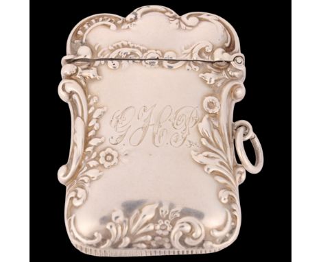 A late Victorian silver Vesta case, Levi & Salaman, Birmingham 1896, shaped rectangular form with relief embossed foliate dec