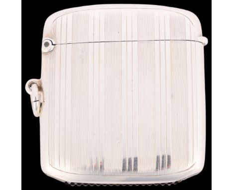 A George V silver Vesta case, Adie Brothers Ltd, Birmingham 1923, rounded rectangular form with engine turned decoration, 5cm