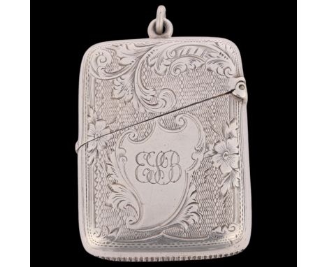 An Edwardian silver Vesta case, Colen Hewer Cheshire, Chester 1902, rounded rectangular form with allover engine turned and f