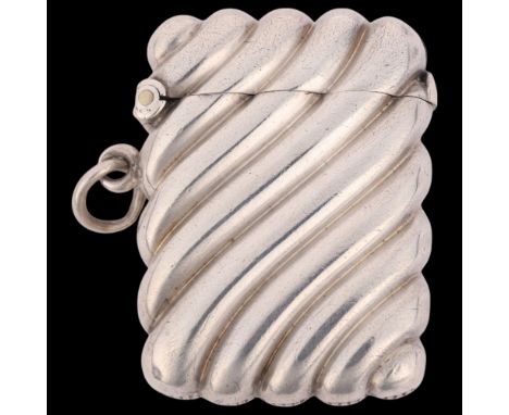 A late Victorian silver Vesta case, William Neale, Birmingham 1897, rectangular form with allover fluted spiral decoration, 4