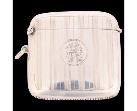 An Art Deco George V silver Vesta case, John Rose, Birmingham 1915, curved square form with engine turned decoration and gilt