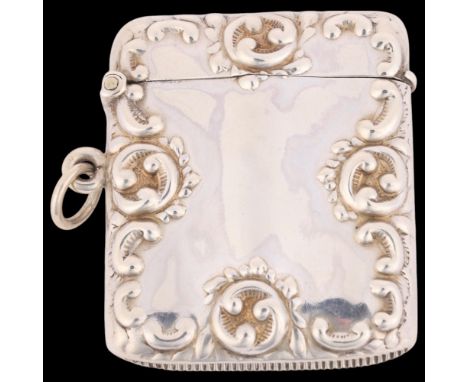 A late Victorian silver Vesta case, Thomas Hayes, Birmingham 1901, rectangular form with allover relief embossed foliate deco