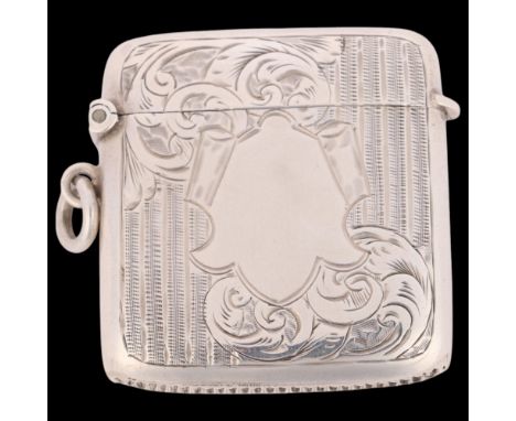 An Edwardian silver Vesta case, Smith & Bartlam, Birmingham 1904, rounded rectangular form with allover engine turned and fol
