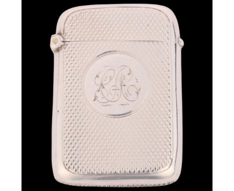 A late Victorian silver Vesta case, Deakin & Francis, Birmingham 1899, rounded rectangular form with allover engine turned de
