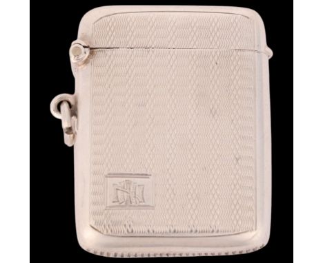 A George V silver Vesta case, Frederick Field Ltd, Birmingham 1926, rounded rectangular form with allover engine turned decor