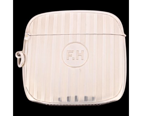 An Art Deco George V silver Vesta case, indistinct maker, London 1921, slimline oval form with allover engine turned decorati