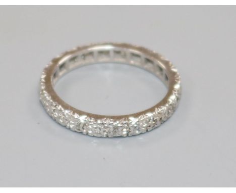 A white metal and diamond set full eternity ring, size K/L.