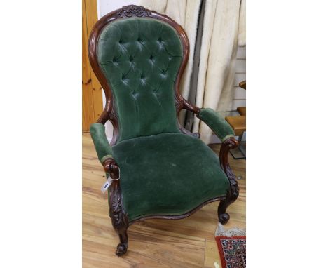 A Victorian mahogany button back open armchair