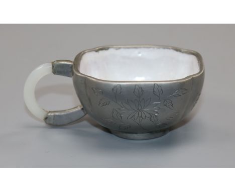 A Chinese Yixing glazed pottery and pewter cup, jade handle