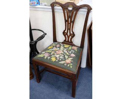 A set of eight dining chairs with tapestry upholstered seats, (six and two carvers)
