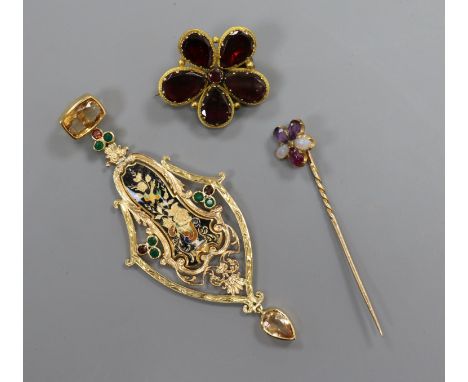 A yellow metal gem set and enamel pendant, a garnet set brooch and a gem set stick pin.