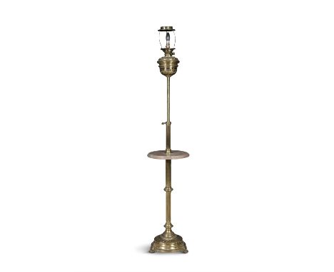 A CONTINENTAL BRASS STANDARD LAMP, the fluted column centred with a circular rouge marble platform, on a circular spreading b