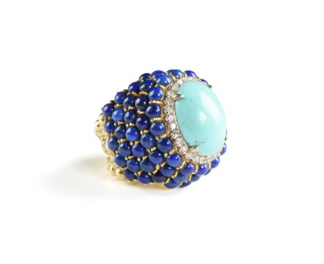 A PERSIAN TURQUOISE, DIAMOND, AND LAPIS LAZULI 18K YELLOW GOLD LADY'S RING, with a central oval cabochon turquoise within a h