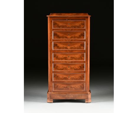A LOUIS PHILIPPE FLAME MAHOGANY SEMAINIER SECRÉTAIRE Á ABATTANT, 1840s, with a flat rectangular recessed top above cavetto mo