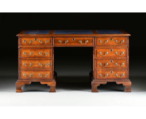A GEORGE II STYLE WALNUT BLUE LEATHER TOP PARTNER'S DESK, ENGLISH, MID 20TH CENTURY, modeled after Library Tables by Thomas C