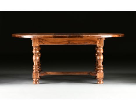 A FRENCH PROVINCIAL STYLE WALNUT DRAW-LEAF DINING TABLE, LATE 20TH CENTURY, in the Louis XIII taste with an oval top above a 