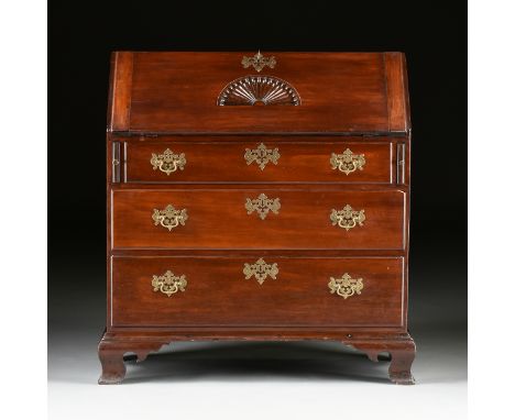 A CHIPPENDALE MAHOGANY SLANT FRONT DESK, 18TH CENTURY, with a flat rectangular top above a slant front hinged door with a lat