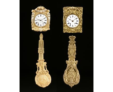 A GROUP OF TWO COMTOISE MORBIER GILT PRESSED BRASS WALL CLOCKS, SIGNED, LATE 19TH CENTURY, one centering a circular white ena