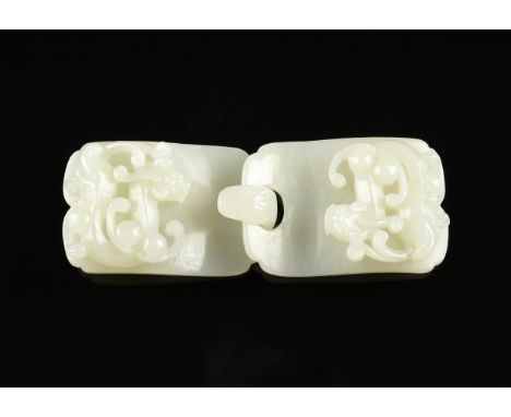 A CHINESE PALE CELADON GREEN JADEITE JADE BELT BUCKLE, LATE QING DYNASTY (1644-1912), each buckle with scalloped corners and 