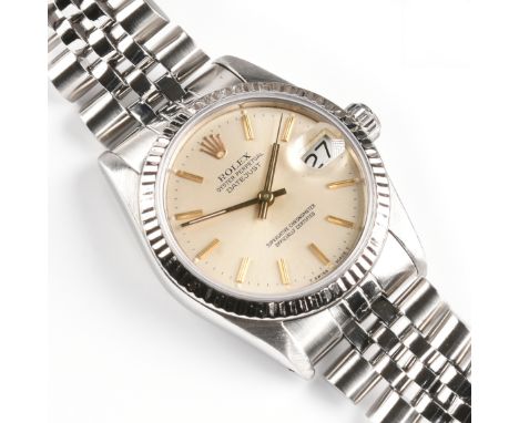 A ROLEX OYSTER PERPETUAL DATEJUST STAINLESS STEEL LADY'S WRISTWATCH, the midsize chronometer, with calendar at 3 o'clock, wit