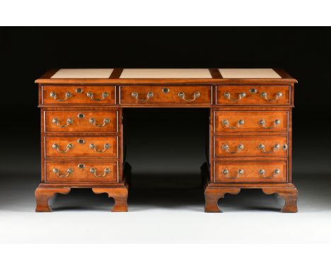 A GEORGE II STYLE WALNUT CREAM LEATHER TOP PARTNER'S DESK, ENGLISH, MID 20TH CENTURY, modeled after Library Tables by Thomas 