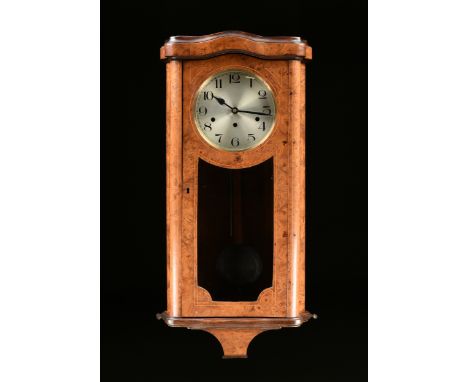 A KIENZLE ART DECO INLAID BURL WALNUT REGULATOR, CARILLON WESTMINSTER CHIMES, GERMAN, 1912-1921, the serpentine arching top o