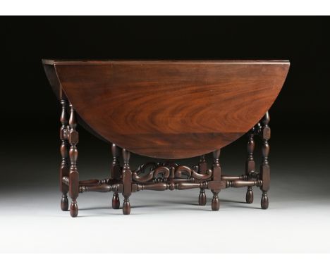 A CHARLES II STYLE MAHOGANY DROP-LEAF GATE LEG DINING TABLE, AMERICAN, EARLY/MID 20TH CENTURY, the elliptical top opening ove