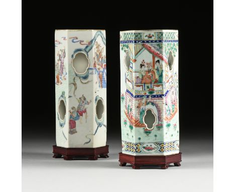 A MATCHED PAIR OF CHINESE FAMILLE ROSE PORCELAIN HEXAGONAL HAT STANDS, each with sides enclosing quatrefoil windows and one R